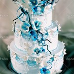 Beautifully decorated wedding cake with blue flowers
